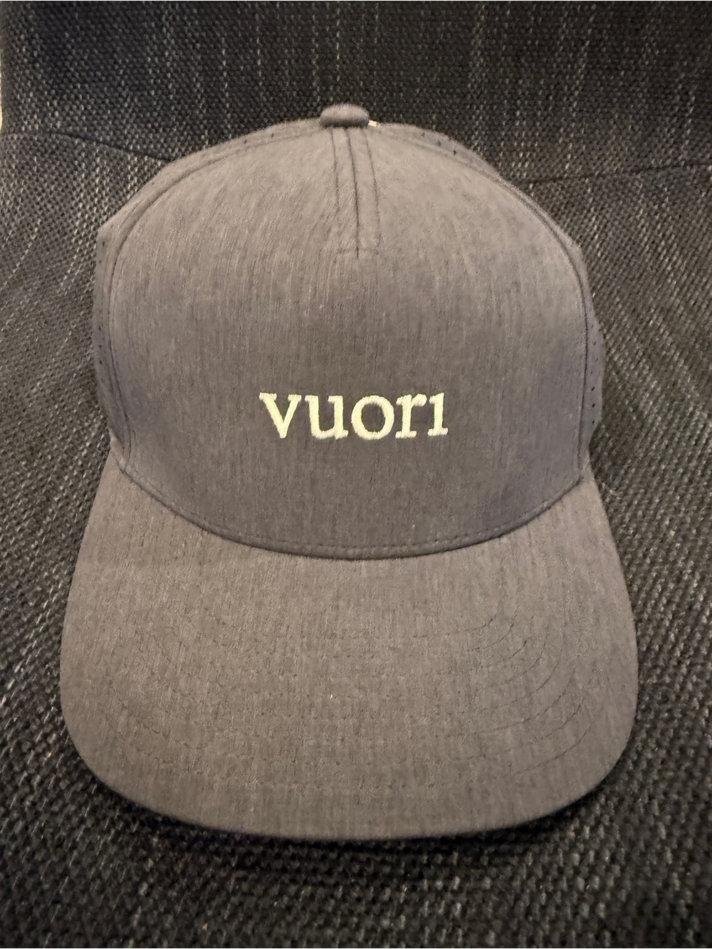 Vuori Navy Blue Embroidered Logo water tech hat